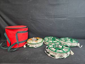 lot 121 image: Set of 4 Storage Reels for Holiday Lights with Red Carrying Bag (untested)