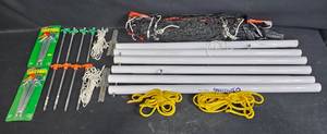 lot 126 image: Complete Camping Tent Setup with Poles, Pegs, and Carry Bag