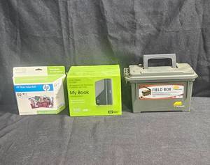 lot 113 image: Lot of 3 Items HP Photo Value Pack, WD My Book 500GB External Hard Drive, Plano Field Box