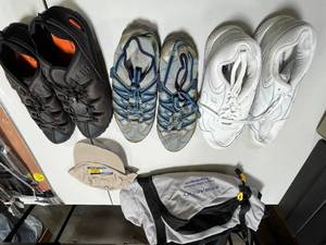 lot 95 image: Lot of Assorted Shoes and Accessories Including Sneakers, Climbing Shoes, Cap, and Bag