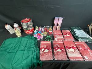 lot 110 image: Lot of 16Huge Lot of Holiday Items Inc Cookie Cutters, Ornaments, Green Cloth Napkins w Matching Tablecloth and 4 Sets 4 (for 12) St. Nick Jacquard Cloth Placemats & 2 Sets of 4 (for 8) Cloth Napkins