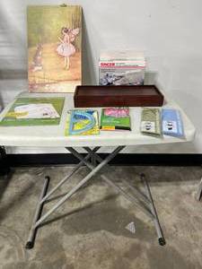 lot 145 image: Small White Folding Table, Wall Art, Singer Mini Mender, Book Covers & More