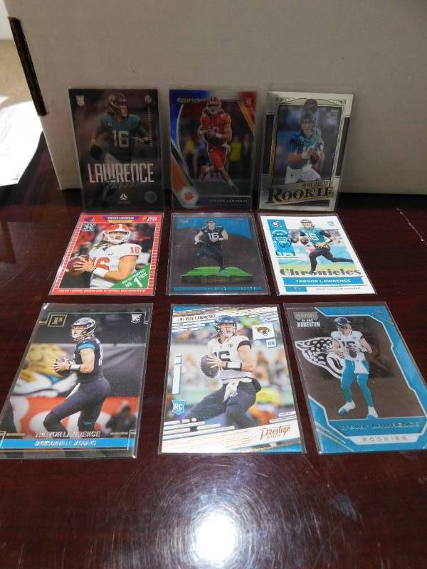 lot 124 image: (9) 2021 Trevor Lawrence Rookies