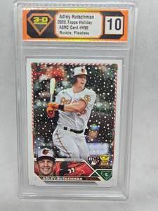 lot 265 image: 3-D Grading 10 Flawless 2023 Topps Holiday Adley Rutschman Rookie #H50
