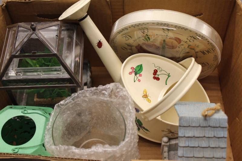 lot P-72 image: Assorted Decorative Items including Watering Can, Clock, and Greenhouse
