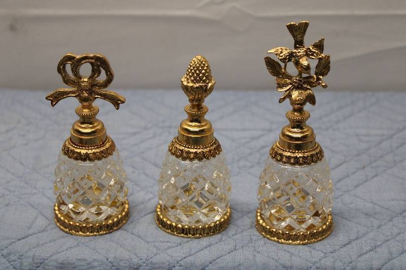 lot 207 image: Set of 3 Vintage Cut Glass and Gold Accent Perfume Bottles