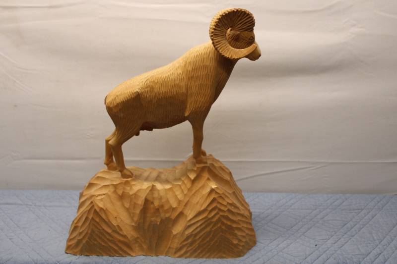 lot 412 image: Hand-Carved Wooden Mountain Ram Sculpture on Rocky Base