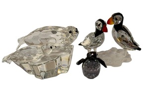 lot 210 image: Swarovski Crystal  A7621 Puffins Pair 261643 and Vintage Swarovski Save Me the Seals - 1991 Annual Edition Figurine