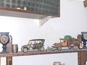 lot 218 image: Assorted Collectibles - Vintage Car, Wooden Delivery Truck, Harley-Davidson Motorcycle, Two 2000 Renaissance Steins, Captain Morgan Wine Barrel Cup, Walkers