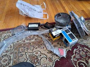 lot 146B image: Lot of  Motorcycle Parts - Harley-Davidson Brake Pad KitFront, Harley-Davidson Screamin Eagle Race Iginition Module, Wix Filter 57060, Drag Specialties Oil Filter, Drag Specialties High-Performance Cables, LED FuelBattery Gauge (New )