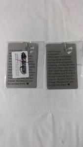 lot 147 image: Set of 2 Inspirational Keychains with Love Quotes