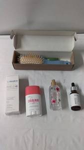 lot 155 image: Skincare and Haircare Bundle with Anti-Stress Cream, Moisturizer, and Hairbrush