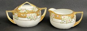 lot 224 image: Vintage Nippon Hand Painted Gold and Floral Design Covered Sugar Bowl and Creamer