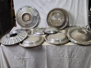 lot 44 image: Lot of 10 Vintage Hubcaps with Various Designs