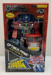 lot 44 image: 2024 Hasbro Transformers Optimus Prime Super Cyborg (NIB) Packaging Shows Signs Of  Wear
