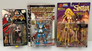 lot 87 image: Misc. Collectible Action Figures Including Sinthia Princess Of Hell, Warrior Nun Areala & Youngblood Team Leader Shaft (NIB) Packaging Shows Signs Of Shelf Wear