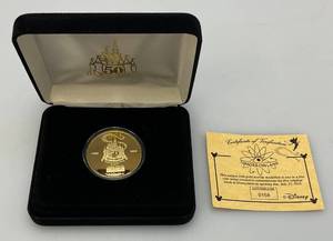 lot 120 image: Disney 50 Year Tomorrowland Collectors Coin  No. 0158 With COV (NIB)