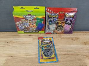 lot 32A image: Brand New Pokemon Trading Cards Including Mystery Power Box, TCG Booster Packs and Pawmot Pack I