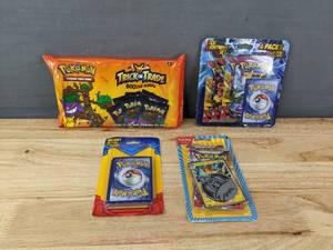 lot 55B image: Brand New Pokemon Trading Cards Packs Including Trick or Treat Booster Bundle, TCG Lightening Set, Pawmot Set and a 21 Card Pack I
