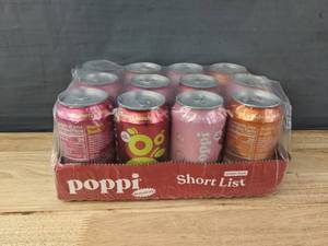lot 34 image: Assorted 11 Poppi Prebiotic Soda in Cherry Lemonade, Raspberry Rose, Orange, Strawberry Lemonade N