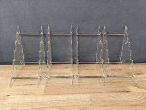 lot 99 image: Set of 4 Clear Knife Display Stands K