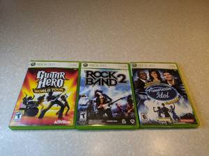 lot 448 image: 3 Total XBOX 360 Guitar Hero World Tour Rock Band 2 American Idol Encore R