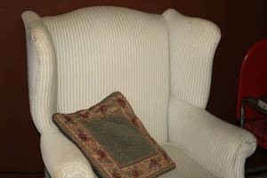 lot 6 image: Used Wingback Chair with Decorative Pillow