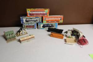 lot 85 image: Lot of HO Scale Train Models and Accessories Including Cars, Engine, and Buildings