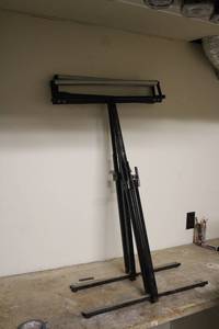 lot 329 image: Heavy-Duty Adjustable Black Metal Drafting Table Stand with Rollers