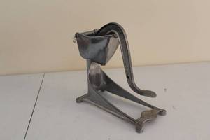 lot 218 image: Vintage Wear-Ever Aluminum Potato Masher  Food Grinder