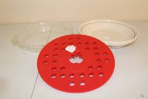 lot 229 image: Set of 3 Baking Dishes with Red Silicone Pie Crust Shield