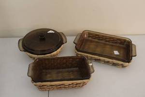 lot 235 image: Set of 3 Glass Bakeware Dishes with Woven Rattan Covers