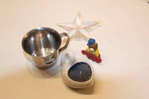 lot 298 image: Lot of 5 Unique Items Stainless Steel Cup, Porcelain Swan Candleholder, Plastic Beaver Figurine, Clear Star Decoration, and Vintage Patch