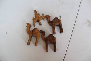 lot 374 image: Set of 4 Decorative Wooden Camel Figurines