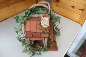 lot 412 image: Decorative Wooden Birdhouse with Moss and Ivy Accents