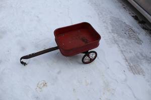 lot 580 image: Vintage Red Metal Toy Wagon with Wheels