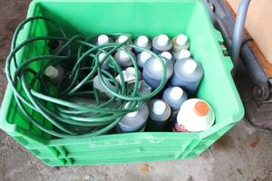 lot 592 image: Collection of Automotive Fluids and Green Hose Set