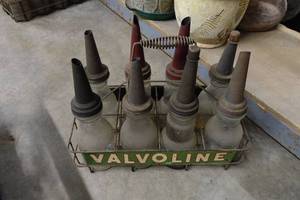 lot 317 image: Antique Oil Bottles with Spouts and Valvoline Carrier