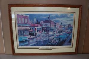 lot 38 image: Ken Zylla Framed Print - Reflections of Main St - 64519600