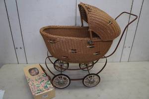lot 63 image: Wicker Baby Buggy with Doll