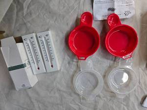 A lot of Microwave Egg Cooker Set of 2 and a pack of Dual Functional Thermometers set of 2
