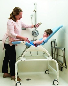 lot 15 image: MSRP $1800 Rifton Wave Bathing & Transfer System&nbspAdjustable Reclining Bath Shower Chair - In Great Condition