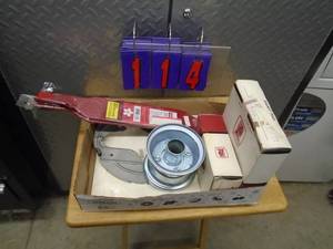 lot 114 image: Flat of lawn mower parts. Rim, 54� blades & motor parts. As shown.