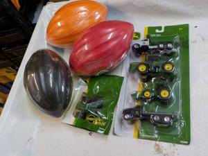 lot 65 image: John Deere Toys and Footballs...