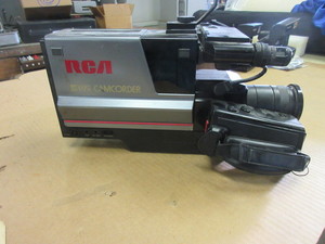 lot 626 image: VINTAGE RCA VHS CAMCORDER WITH CHARGER AND BATTERIES