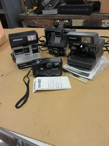 lot 627 image: VINTAGE POLAROID AND OLYMPUS CAMERAS