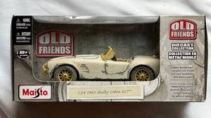 lot 63 image: 1965 Shelby Cobra 427 124 Diecast Maisto Old Friends Car