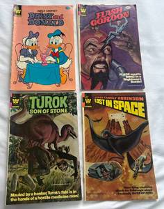 lot 98 image: (4) Vintage Comic Books - Walt Disney, Flash Gordon, Lost in Space, Turok