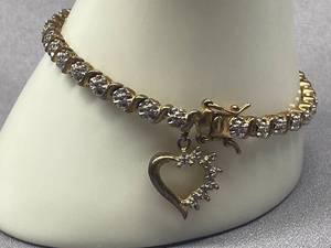 lot 14B image: Elegant Sterling Silver Tennis Bracelet with Heart Charm
