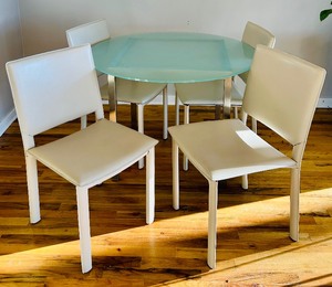 lot 26 image: Gorgeous Glass Top Table with Four Neutral Modern Style Leather Chairs